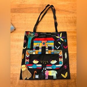 folk art embroidery bag likely in style of Mexican Otomi/Peruvian Arpillera